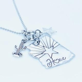 Arizona home charm necklace with saguaro cactus and flag star close up