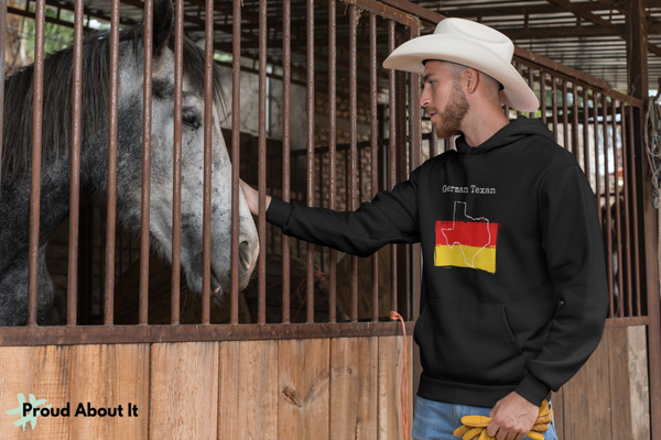 man petting a horse wearing a black German Texan Unisex Hoodie | German Heritage, Texas Pride