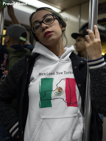woman on subway wearing a white Mexican New Yorker Unisex Hoodie – Mexican Pride, New York Style