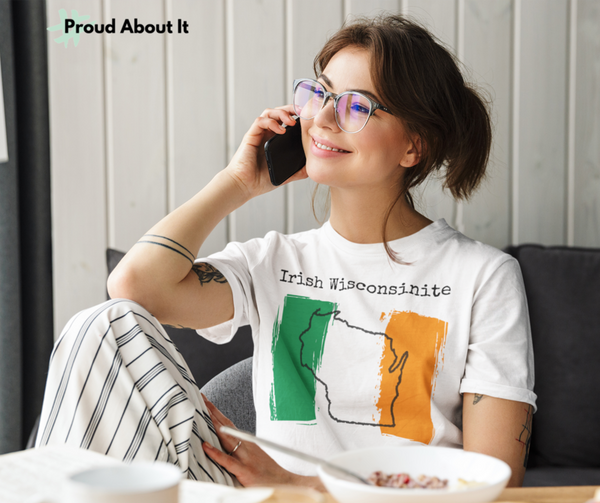 woman talking on phone wearing a white Irish Wisconsinite Unisex T-Shirt – Irish Pride, Wisconsin Pride