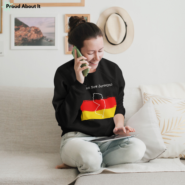 woman on phone wearing a black German New Jerseyan Unisex Sweatshirt - German Ancestry, New Jersey Pride