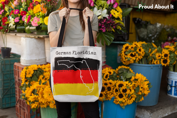woman in flower shop holding a German Floridian Tote - German Ancestry, Florida Pride